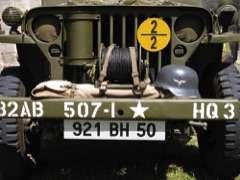 Vintage World War 2 jeep with helmet, Normandy